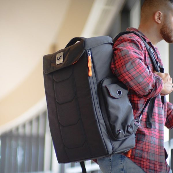 Gruv Gear Stadium Bag Tech Backpack on man's back in airport