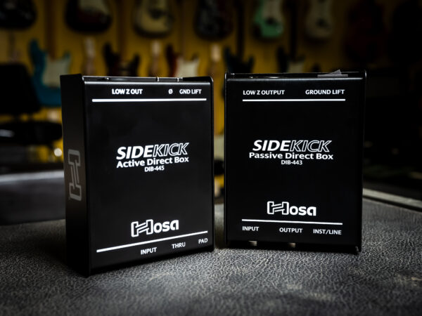 Two DI boxes from Hosa Technology, showcasing the different features available in active and passive models. These devices are used to connect instruments like guitars and basses to recording and sound reinforcement equipment.